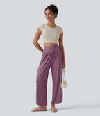 Pantalon décontracté taille haute gainant avec ourlet arrondi et poches
