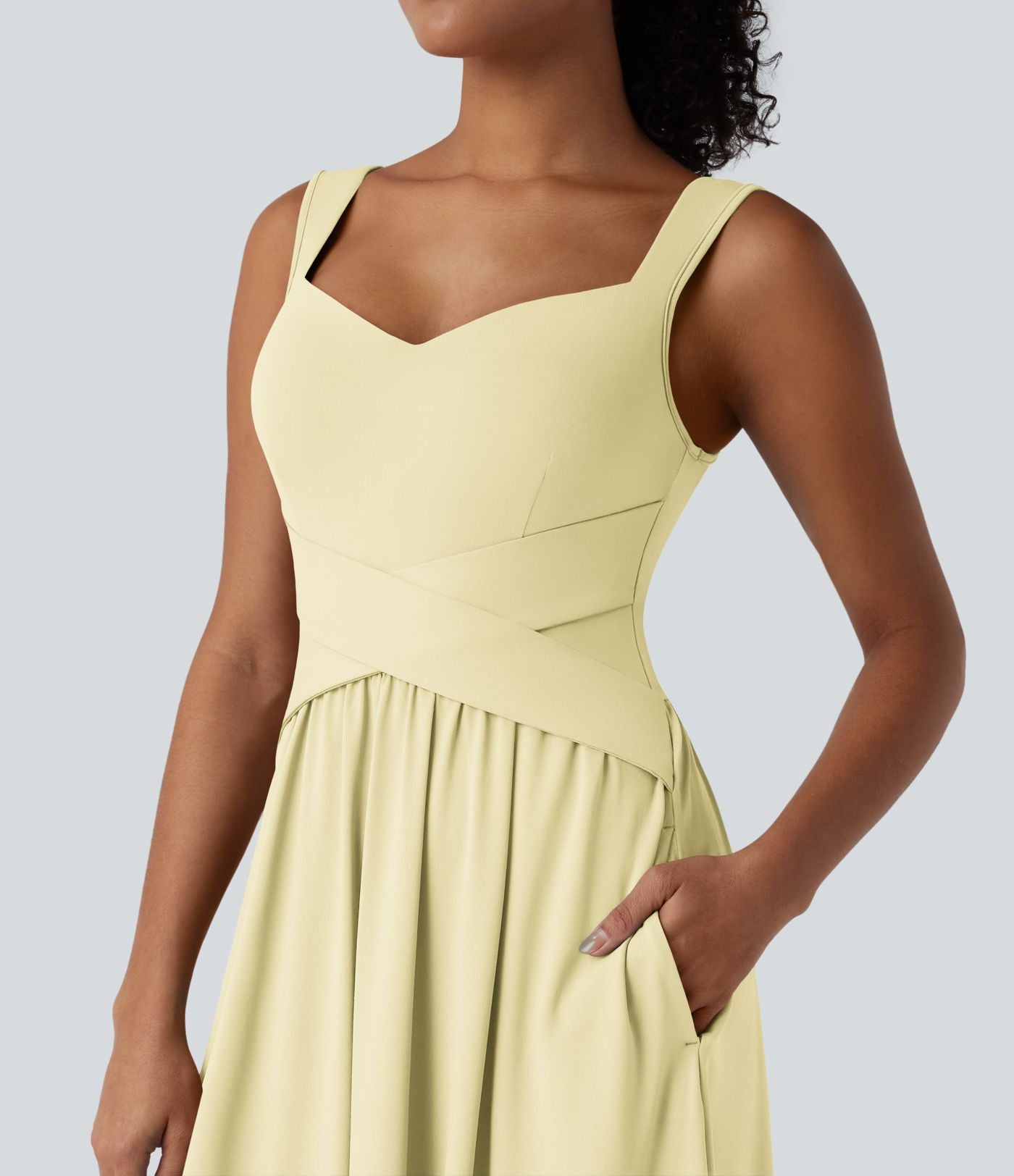 Robe midi fluide sans manches dos croisé ouvert avec poches