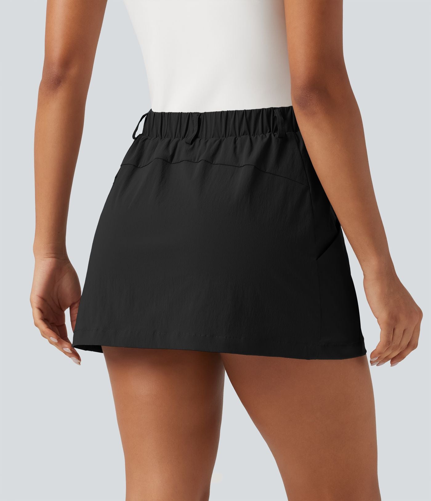 Jupe-short de golf mini taille mi-haute avec poches et porte-tees