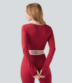 Haut de sport yoga court dos nu à manches longues avec passants pouces et blocs de couleurs sans coutures Seamless Flow