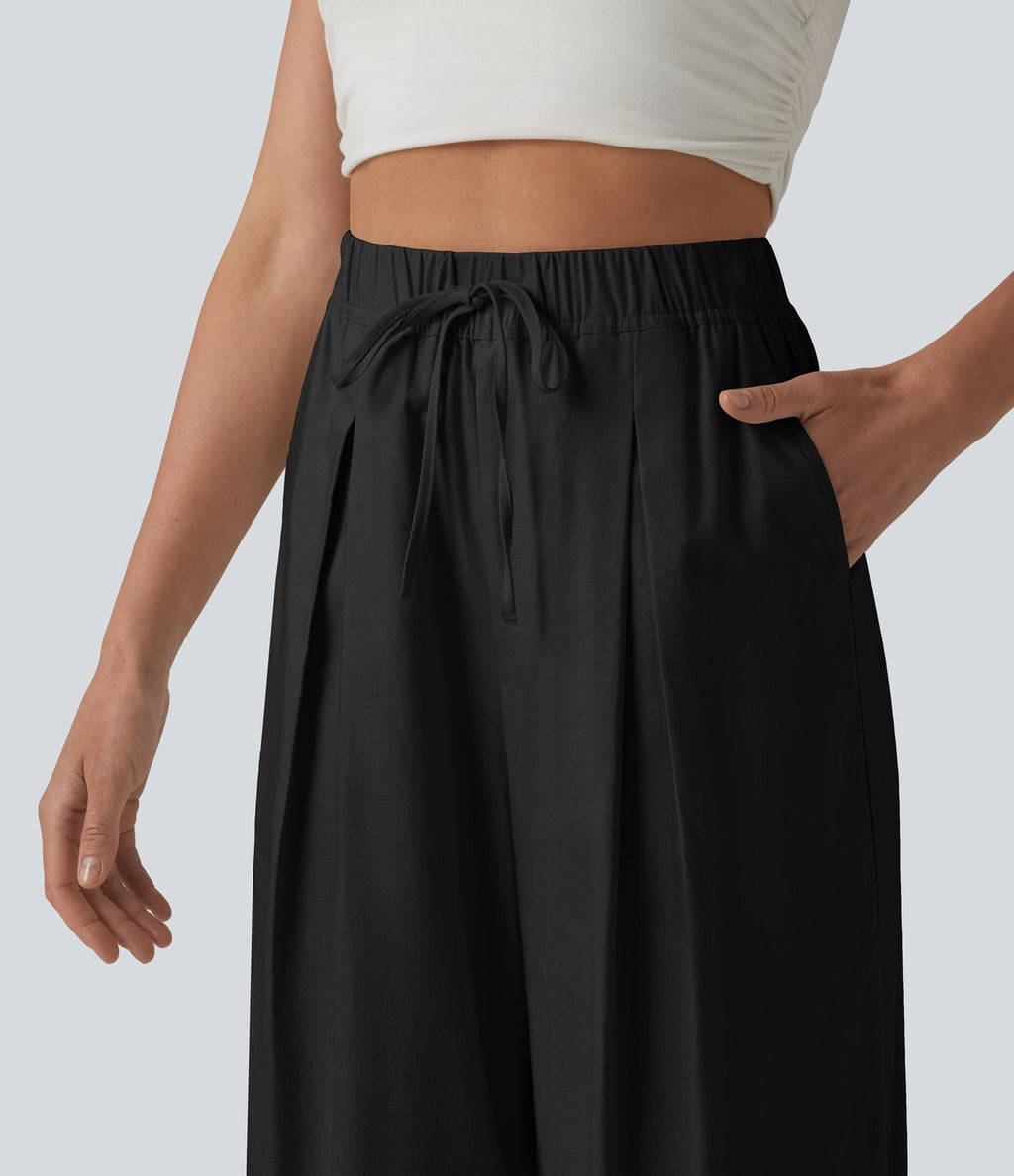 Pantalon casual court en coton et lin taille haute coupe ballon avec cordon de serrage et poches
