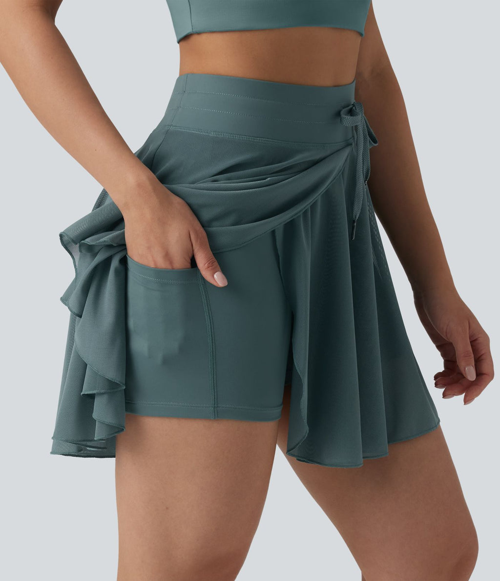 Jupe mini fluide évasée 2-en-1 taille haute à cordon, empiècements en mesh contrastant, avec poche, version plus longue