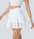 Jupe courte de yoga évasée 2-en-1 taille haute croisée avec poches latérales et motif perforé