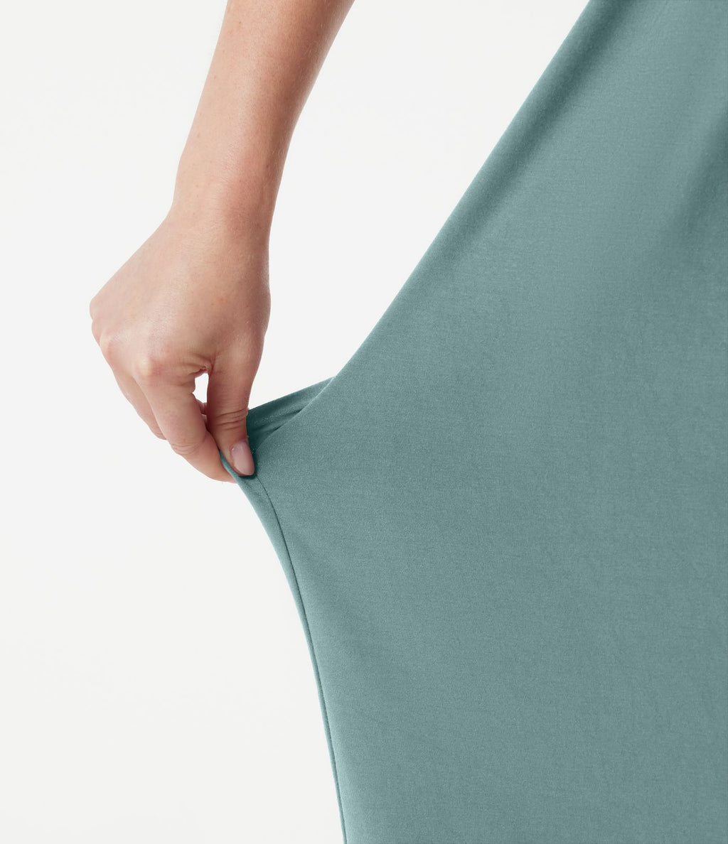 Robe midi dos nu à col halter avec lien noué au dos et poches