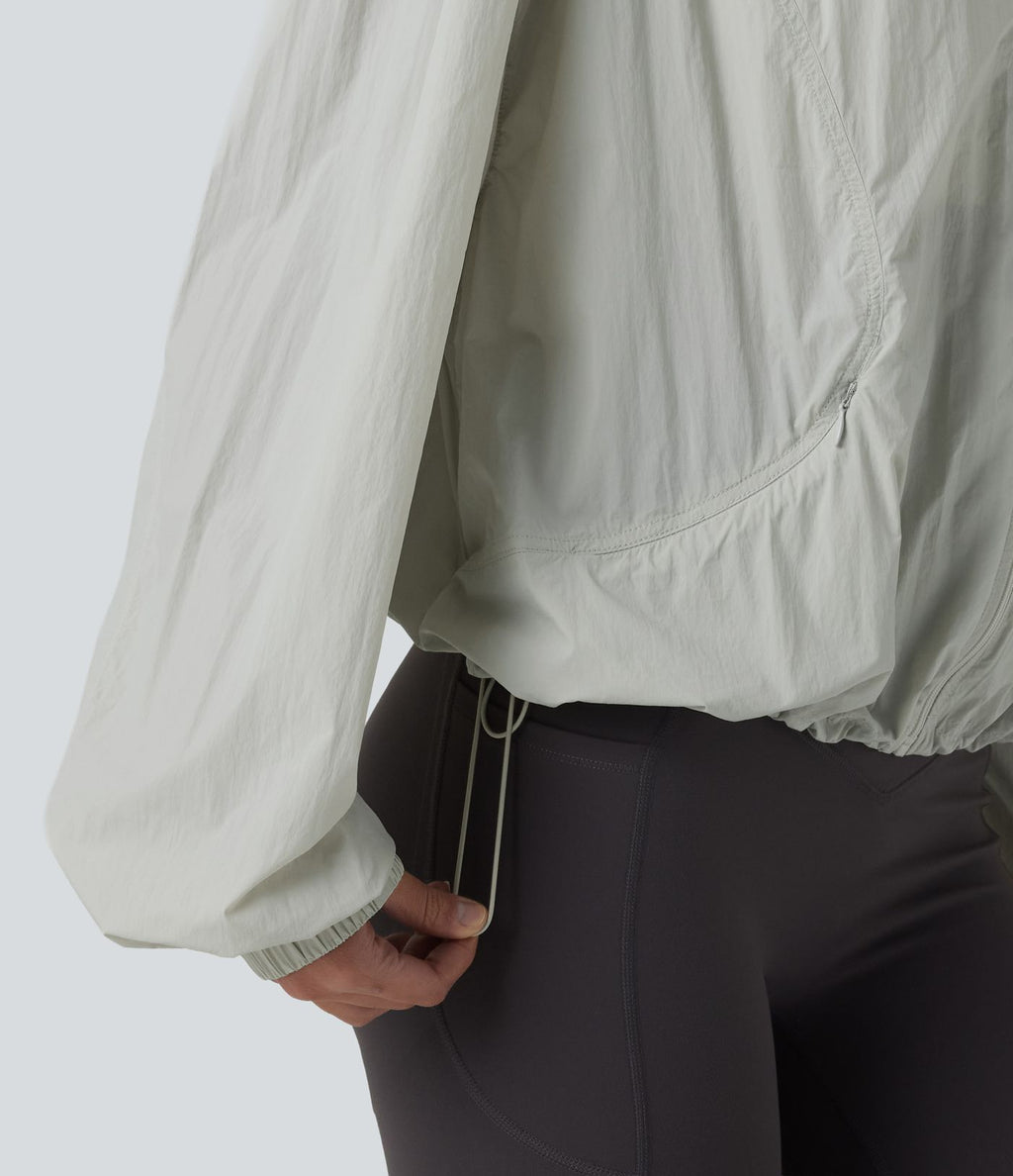 Veste de course légère à capuche manches longues avec poches, cordon de serrage et protection UPF 50+