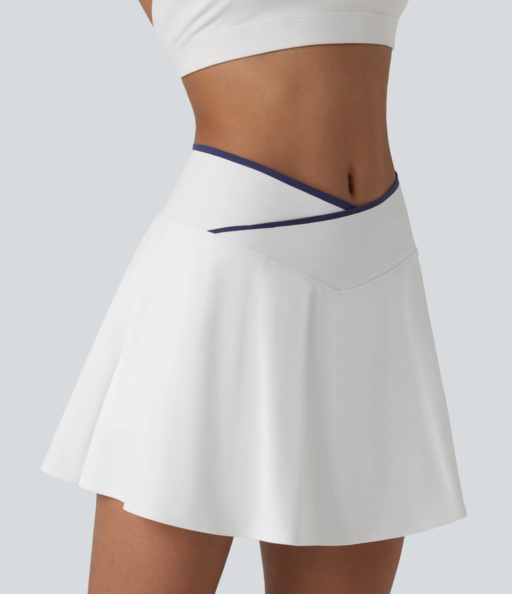 Jupe de tennis mini 2-en-1 color block croisée taille mi-haute avec poches