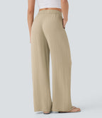 Pantalon large fluide taille haute avec cordon de serrage, poches latérales et aspect lin