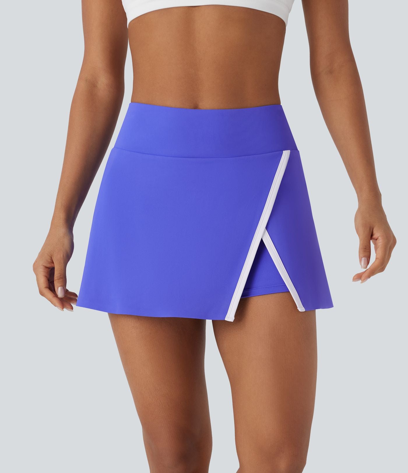 Jupe de tennis mini 2-en-1 à taille haute, fente, blocs de couleur et poche latérale