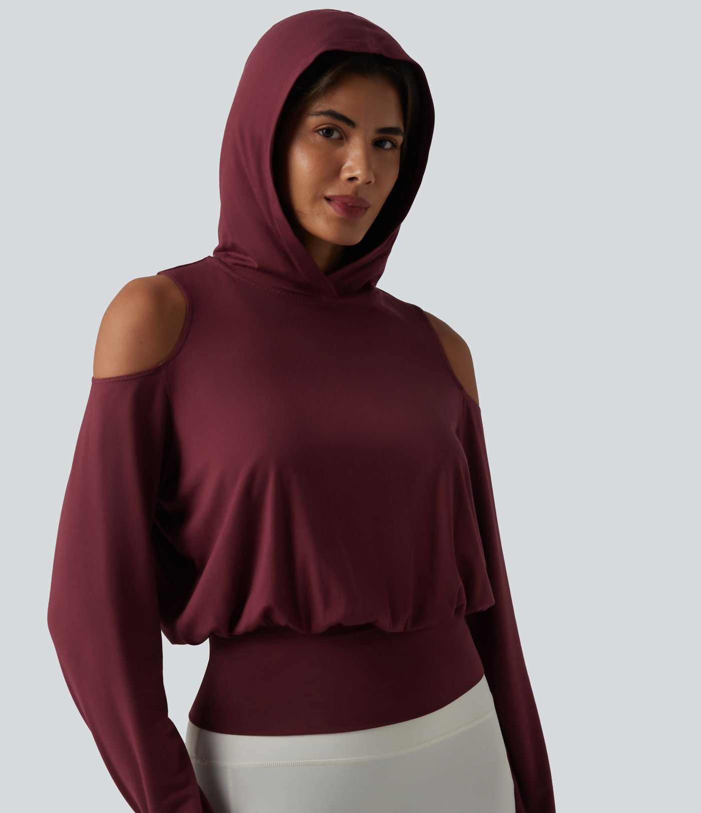 Sweat-shirt de sport à capuche épaules dénudées manches longues