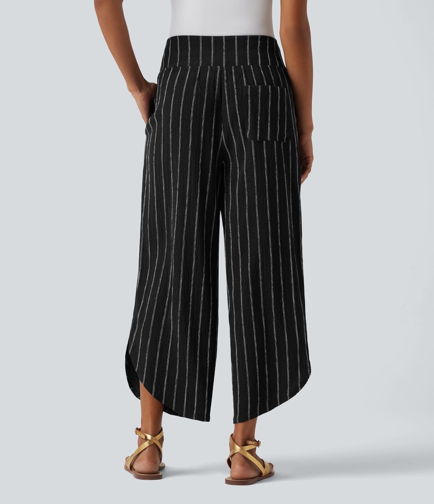 Pantalon rayé taille haute avec ourlet arrondi et poches