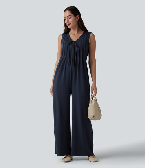 Combinaison casual ample décolleté plongeant sans manches plissée à nœud devant et fermeture éclair invisible avec poches
