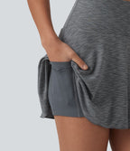 Jupe de sport mini gainante 2-en-1 taille haute à rayures avec poches