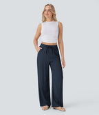 Pantalon large fluide taille haute avec cordon de serrage, poches latérales et aspect lin