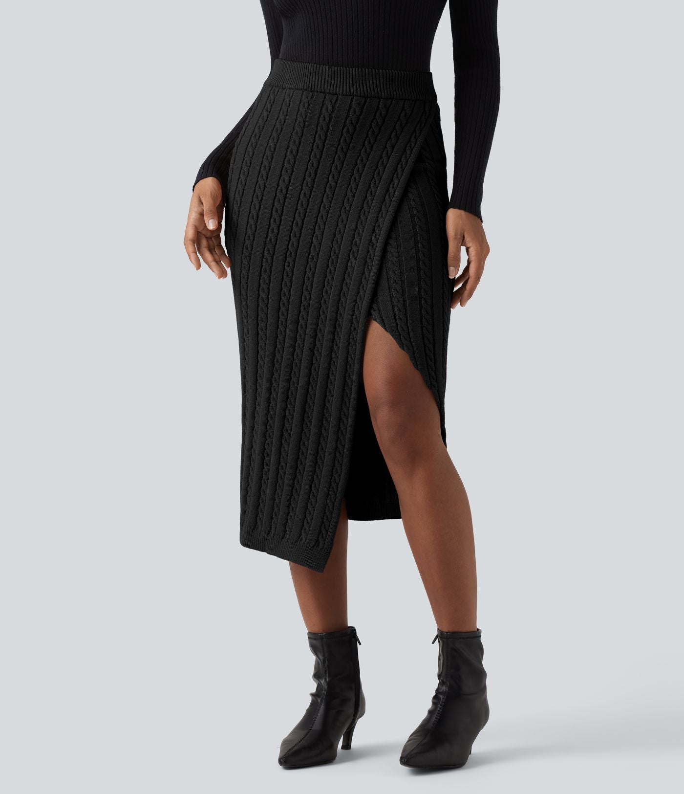 Jupe pull moulante mi-longue taille haute en maille torsadée avec fente