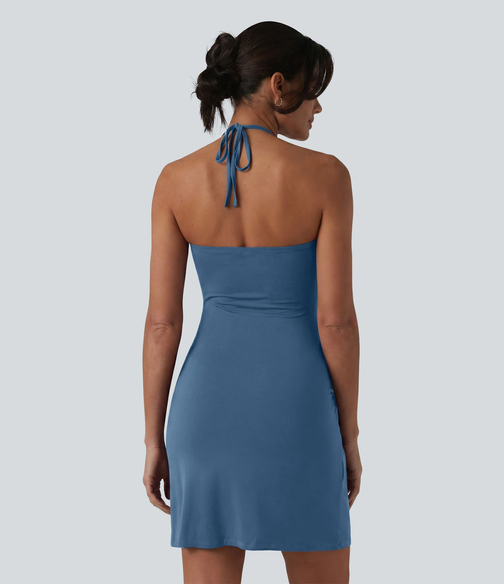 Robe resort mini dos nu à col licou avec lien noué dans le dos et poches