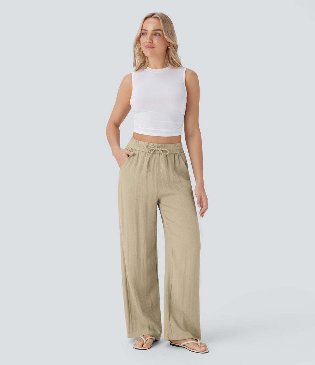 Pantalon large fluide taille haute avec cordon de serrage, poches latérales et aspect lin