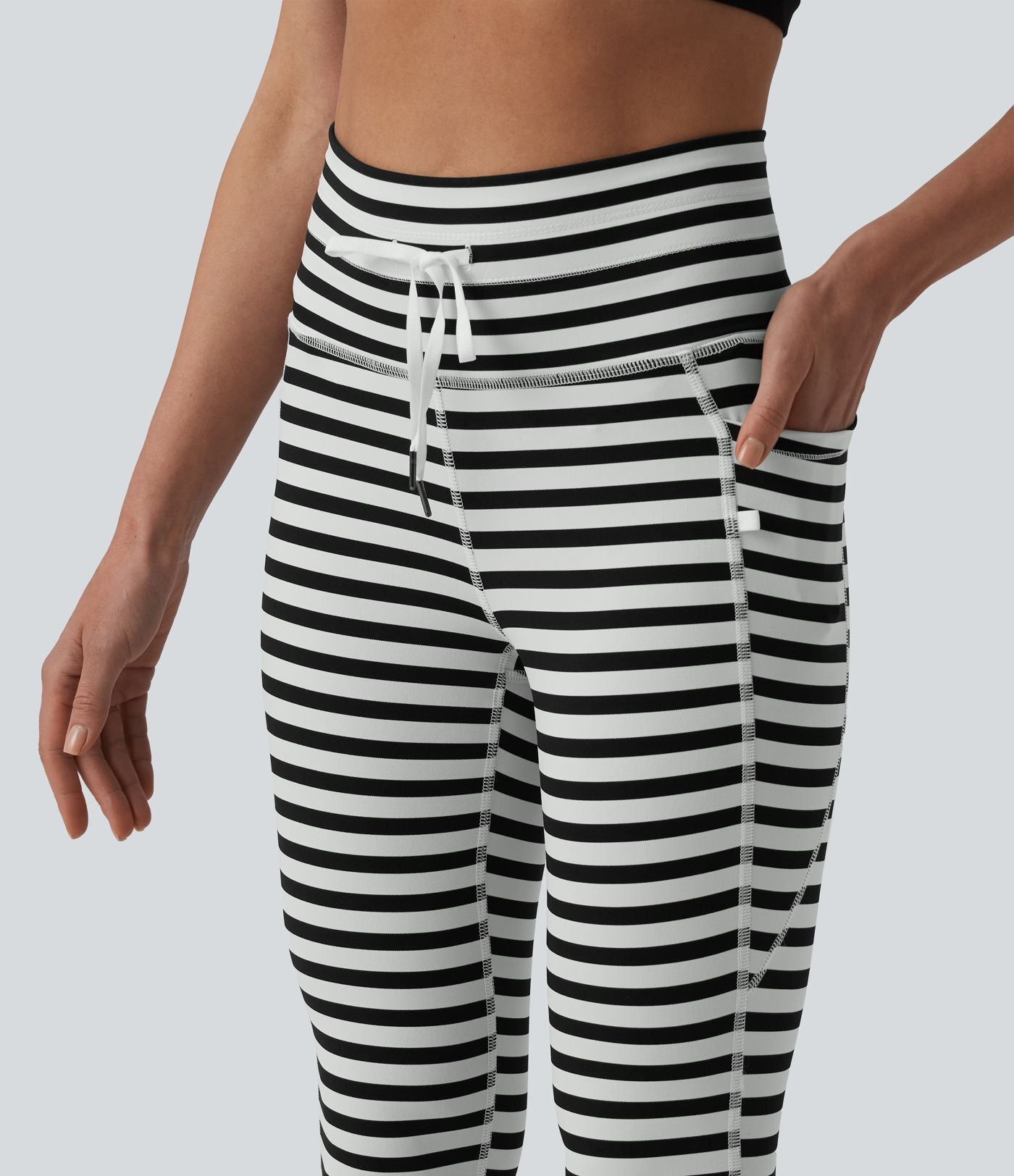 Legging yoga 7/8 taille haute à rayures et cordon de serrage avec poches
