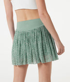 Jupe de sport mini 2-en-1 fluide taille mi-haute en mesh léopard avec poche