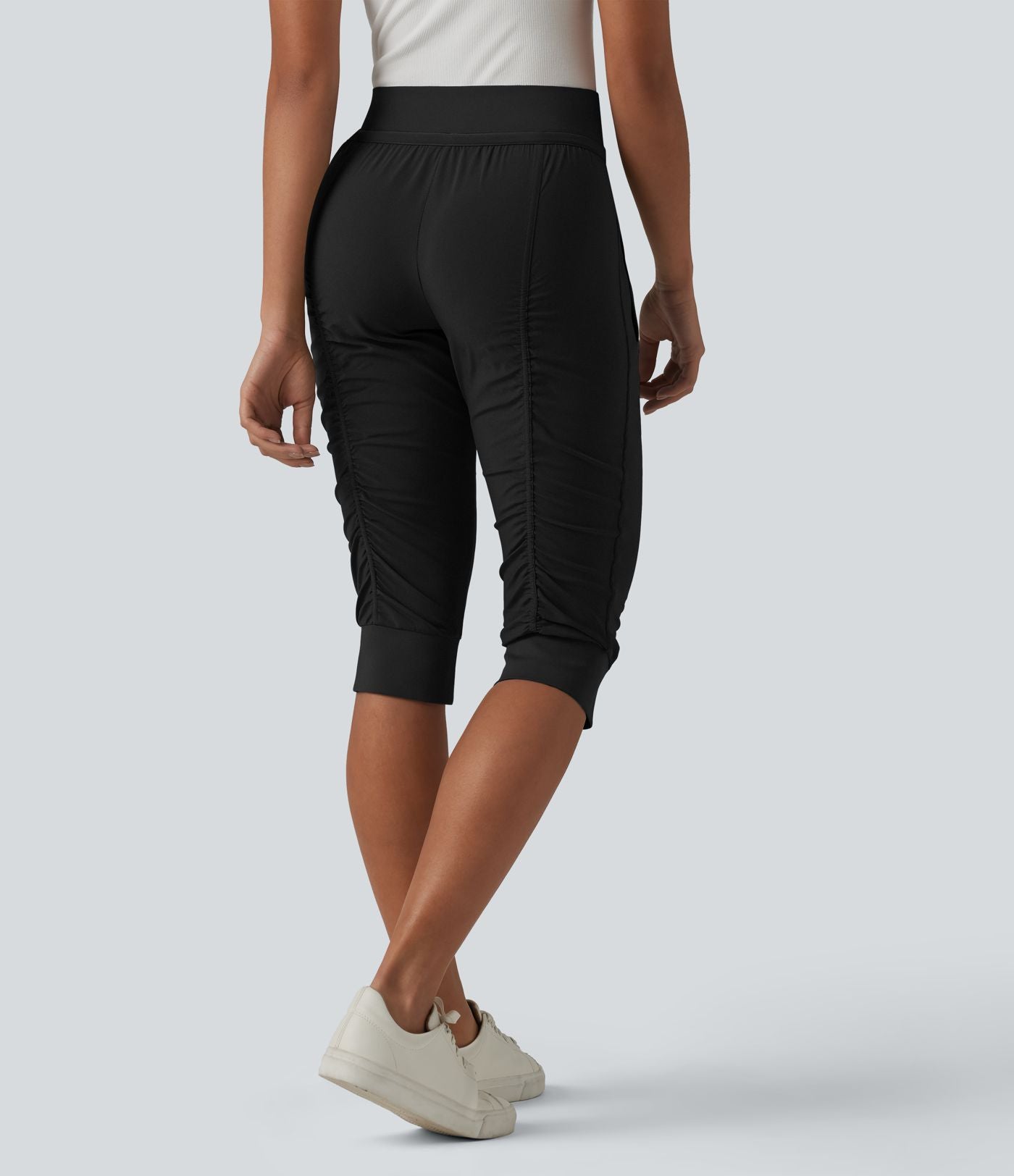 Jogging fuselé taille haute avec cordon de serrage et poches zippées