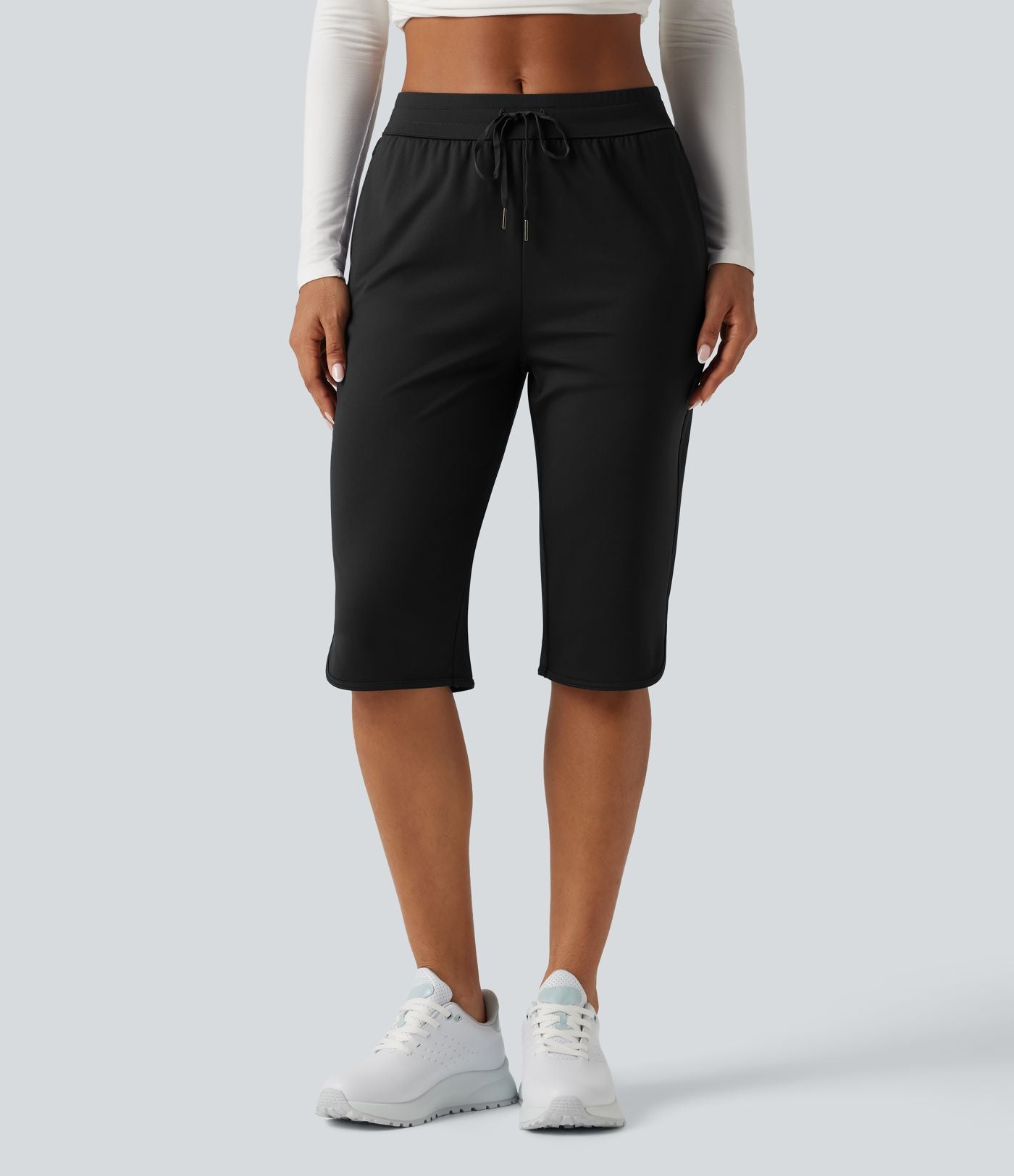 Pantacourt de golf taille mi-haute à séchage rapide avec cordon de serrage, ourlet arrondi, poches et protection solaire UPF40+