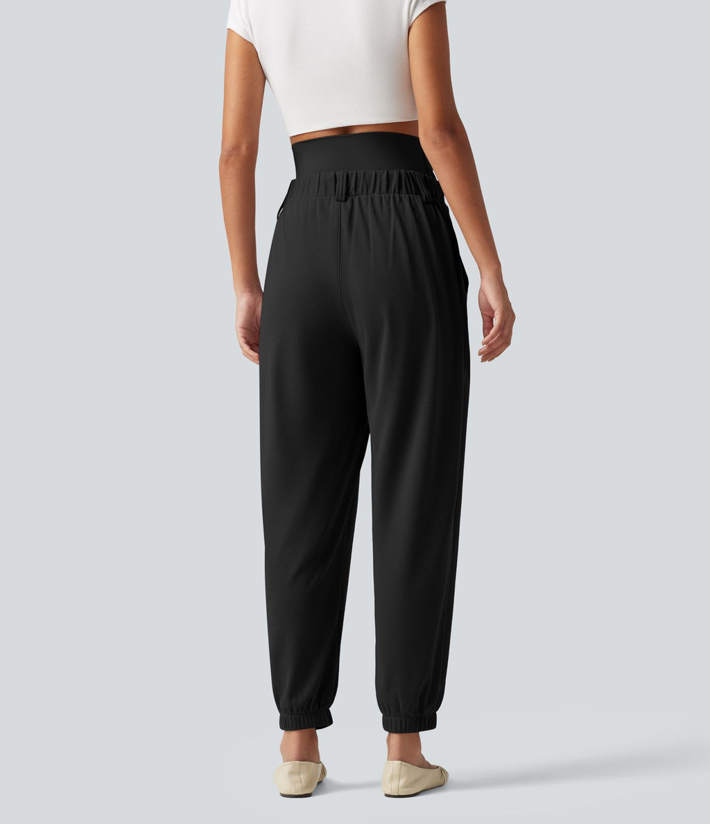 Pantalon de grossesse fuselé taille très haute en tissu gaufré avec poches