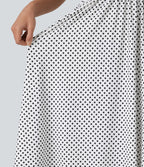 Robe fluide décontractée midi sans manches dos nu croisée à pois avec poches