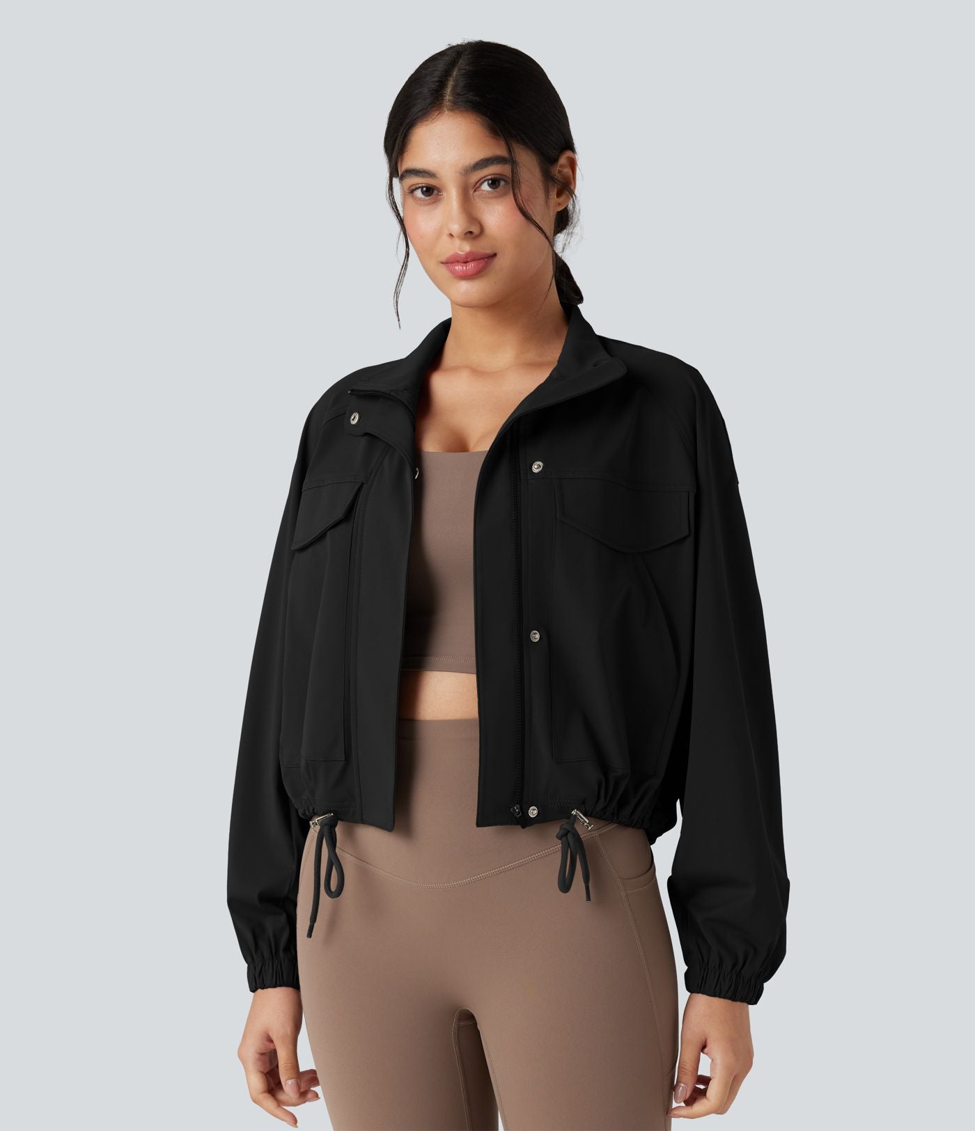 Veste de sport col montant à manches longues avec cordon de serrage et poches