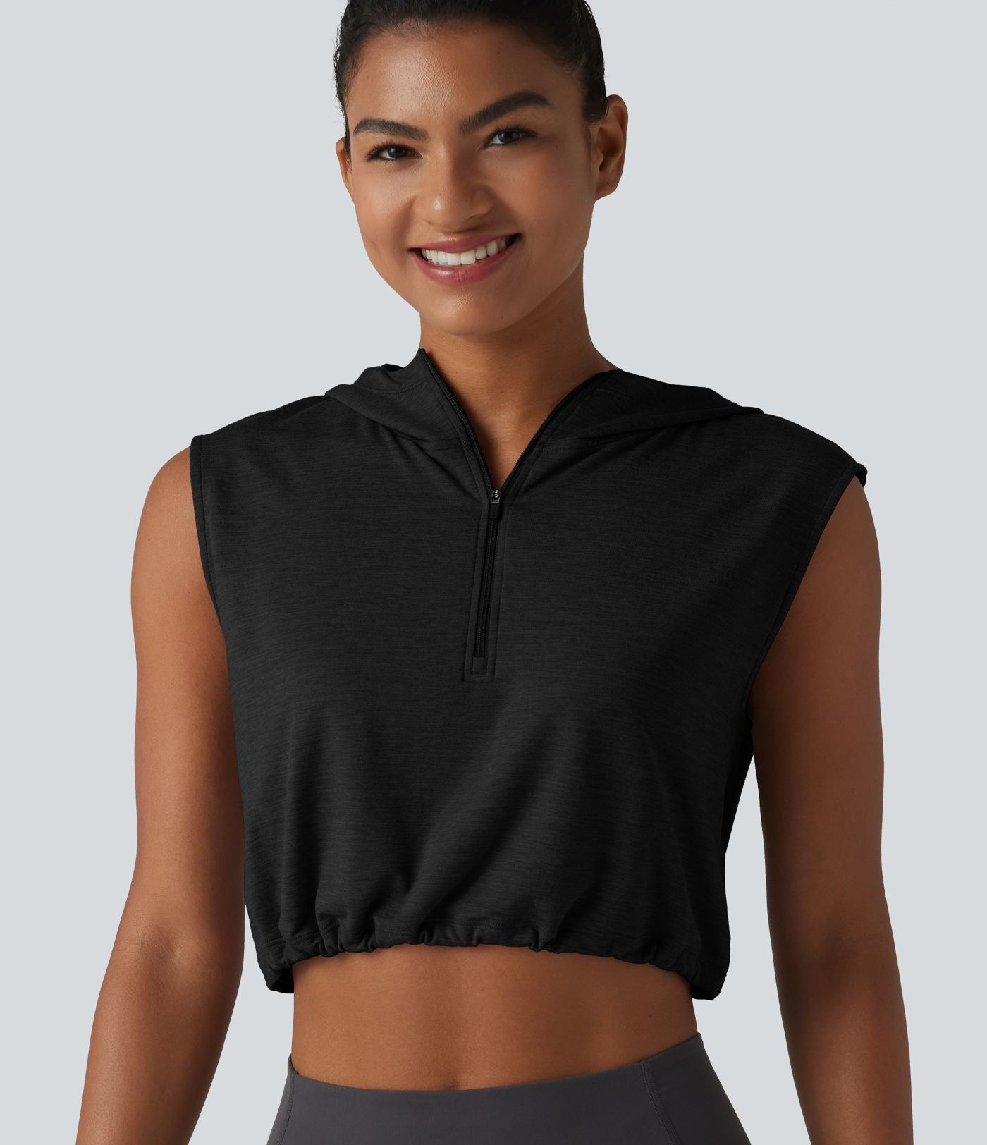 Débardeur de yoga court à capuche avec demi-zip