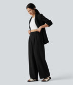 Pantalon tailleur large, taille haute, à poches