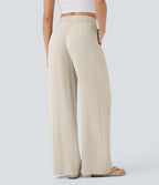 Pantalon large fluide taille haute avec cordon de serrage, poches latérales et aspect lin