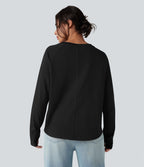 T-shirt décontracté en coton à col rond, manches longues raglan avec passants pouces et ourlet arrondi, coupe ample