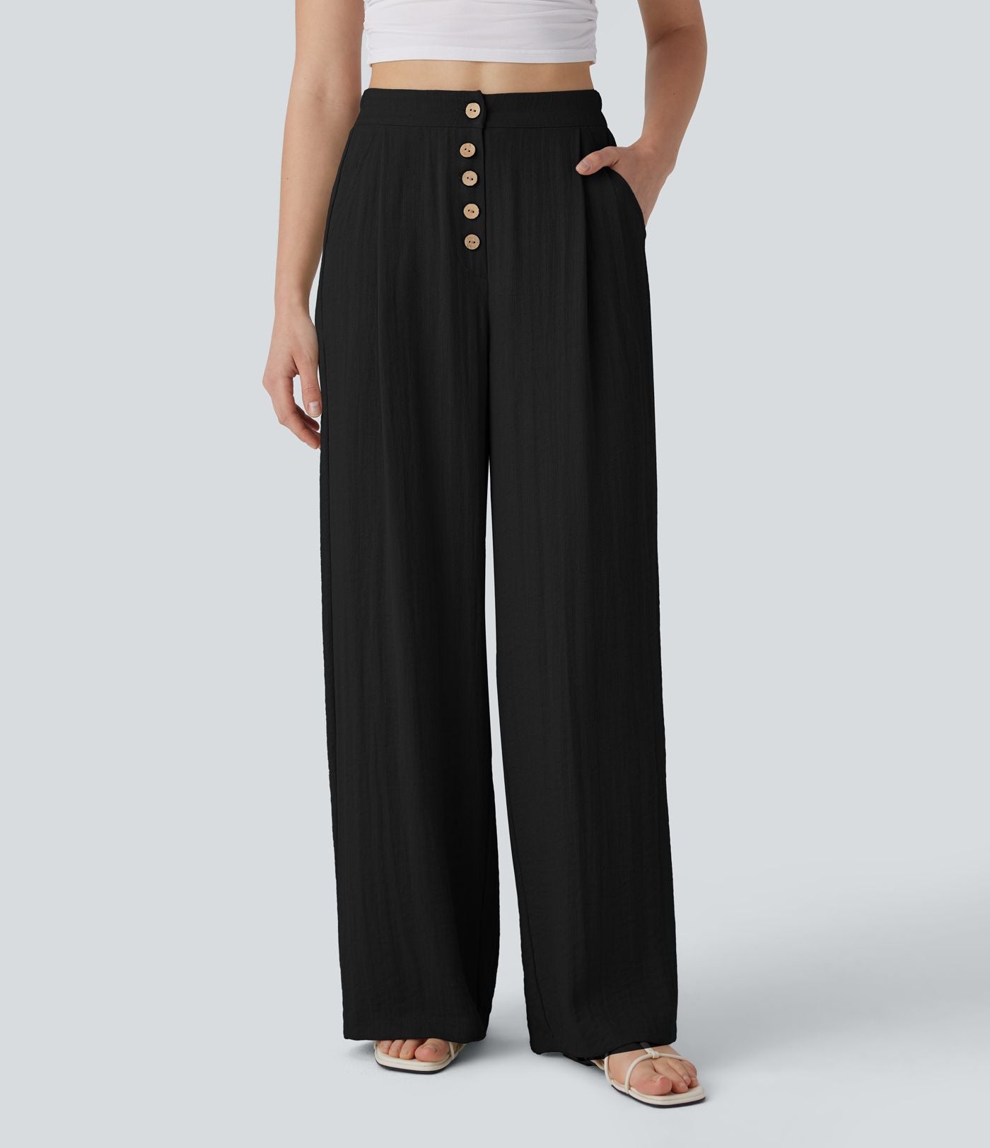 Pantalon large et fluide aspect lin taille haute, boutonné avec poches