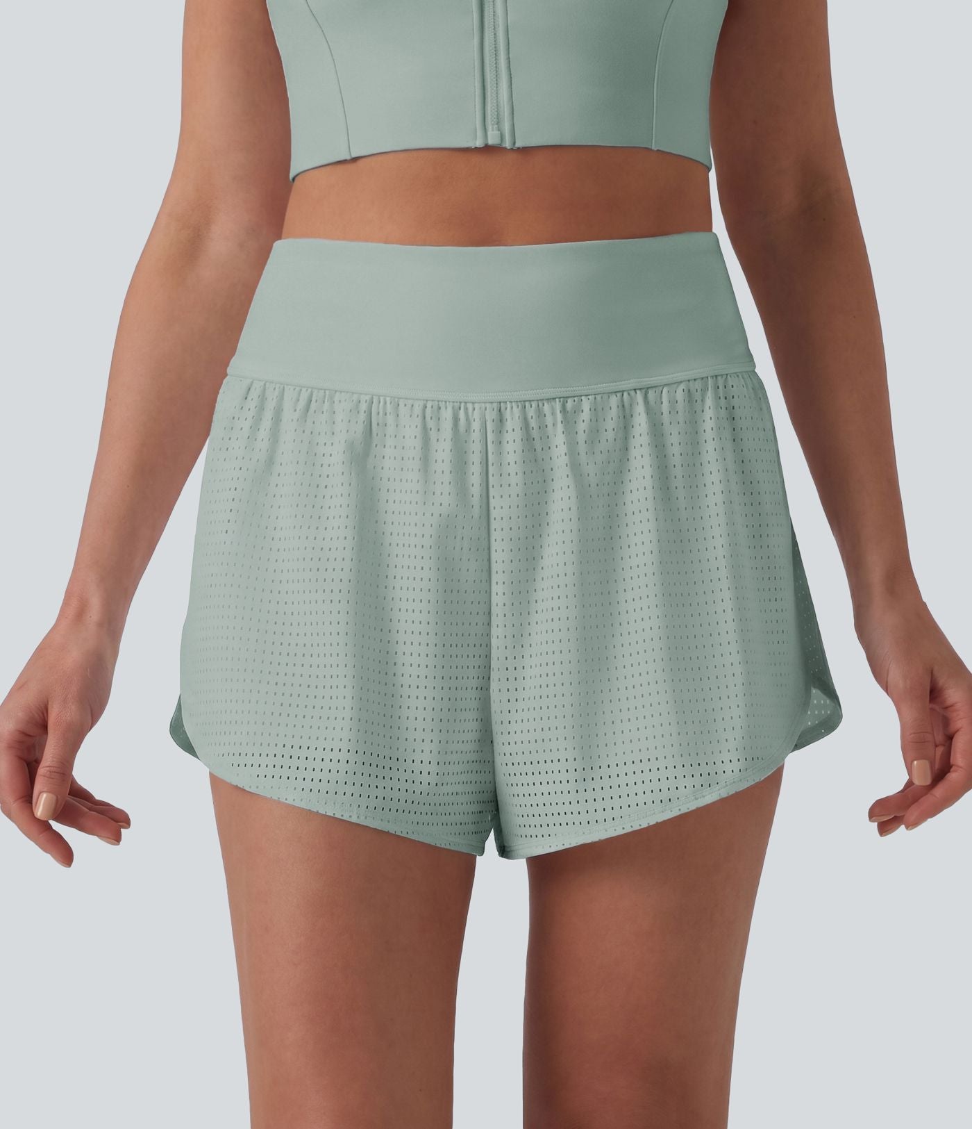 Short yoga 2-en-1 gainant taille haute à pois réfléchissants, ourlet arrondi croisé et œillets avec poches