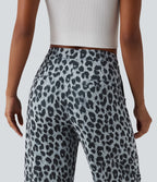 Pantalon tailleur fuselé asymétrique taille mi-haute gaufré imprimé léopard avec poches