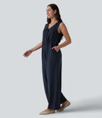 Combinaison casual ample décolleté plongeant sans manches plissée à nœud devant et fermeture éclair invisible avec poches
