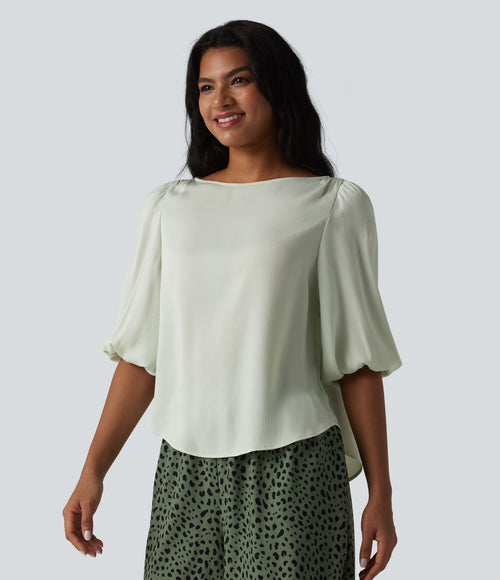 Blouse décontractée à manches bouffantes et ourlet arrondi texturé