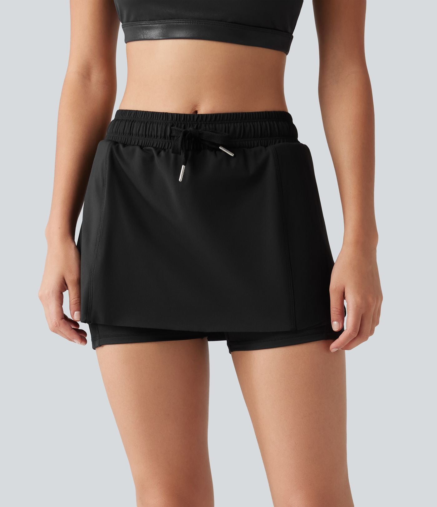 Jupe-short de sport mini SoftlyZero™ Airy taille mi-haute à ourlet croisé, toucher frais, cordon ajustable et poches