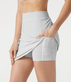 Jupe de golf mini moulante 2-en-1 taille haute à rayures à poches — longueur prolongée