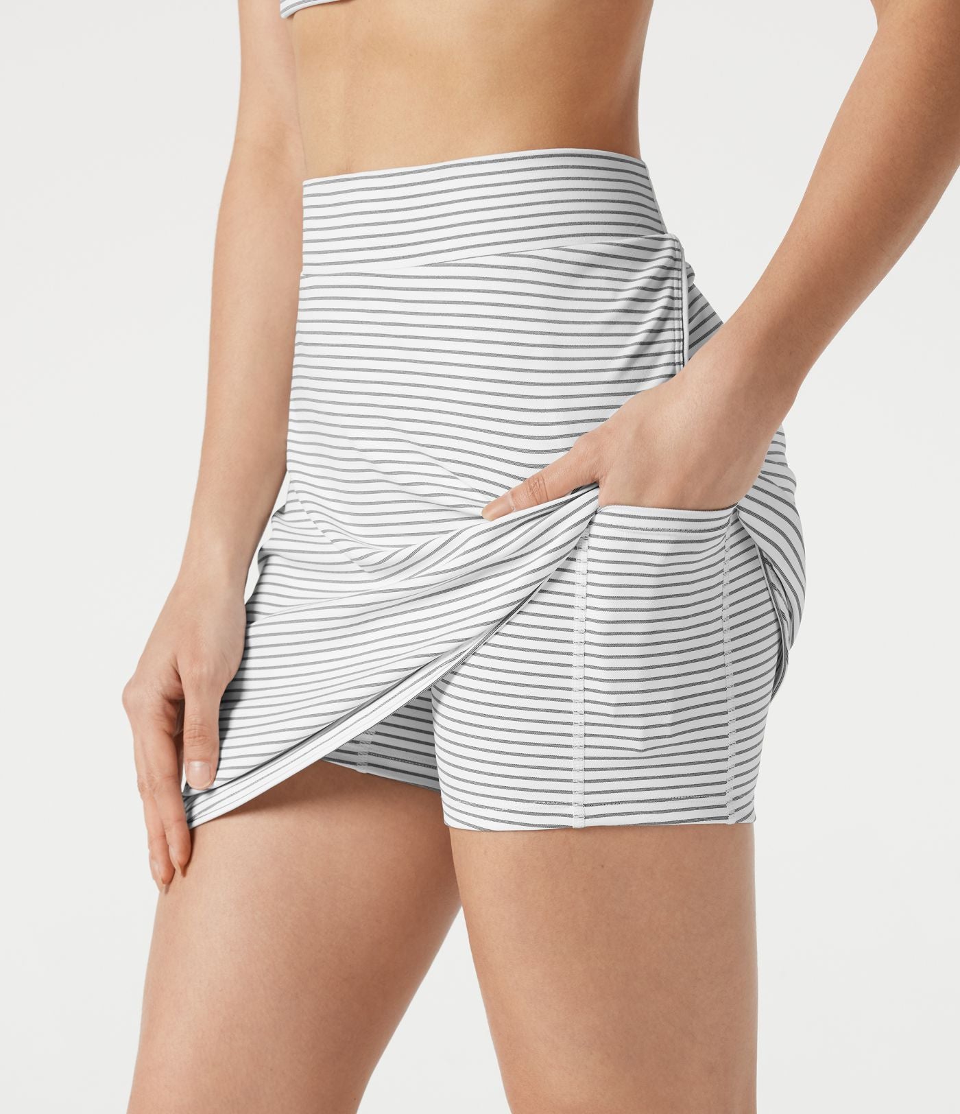 Jupe de golf mini moulante 2-en-1 taille haute à rayures à poches — longueur prolongée