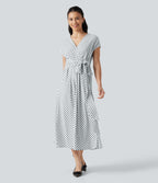 Robe midi à pois col V avec manches courtes, lien côté et poches