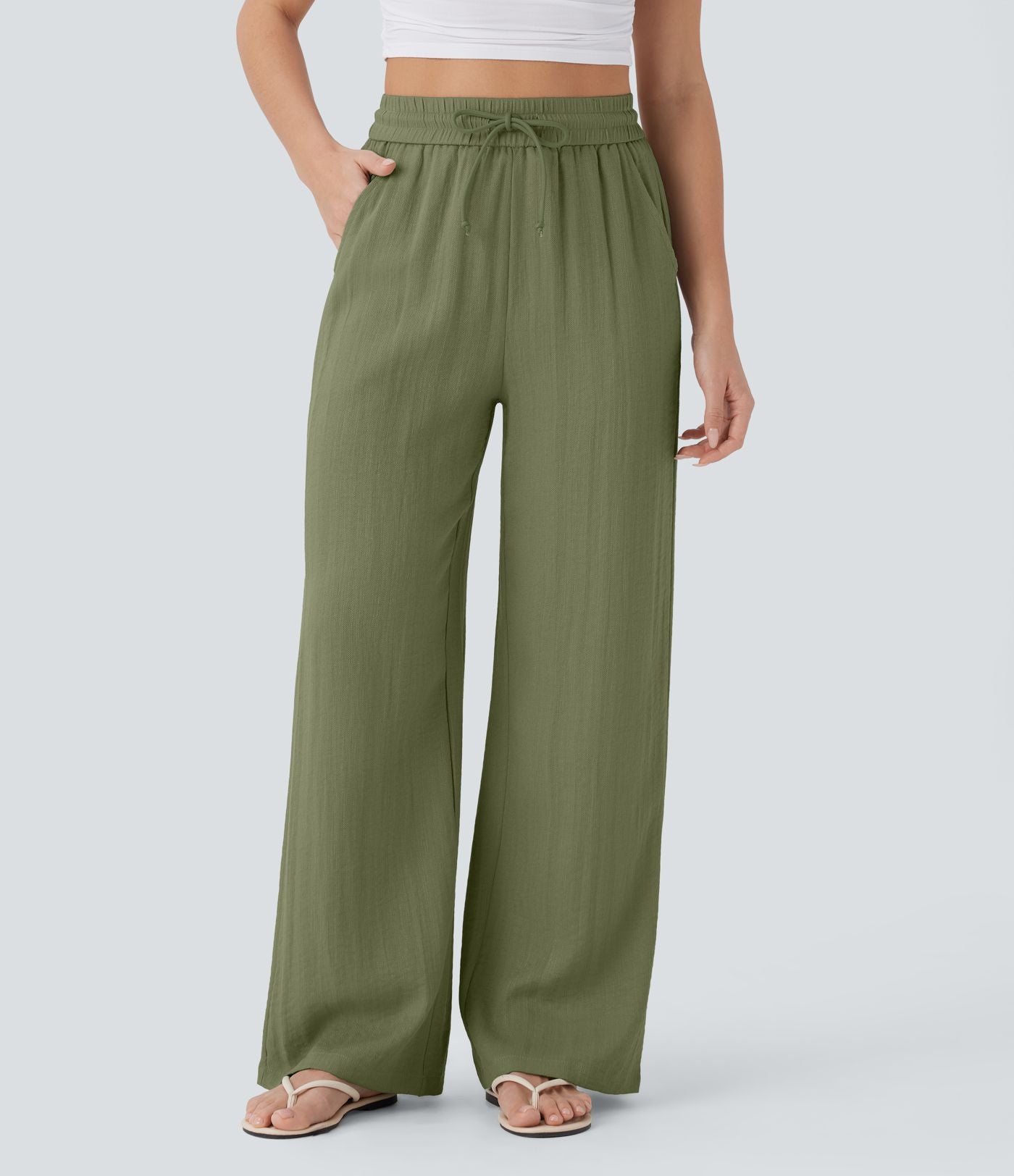 Pantalon large fluide taille haute avec cordon de serrage, poches latérales et aspect lin