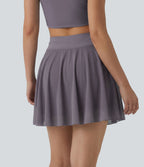 Jupe mini fluide évasée 2-en-1 taille haute à cordon, empiècements en mesh contrastant, avec poche, version plus longue