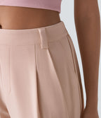 Pantalon tailleur ample, taille moyenne, coupe barrel, à poches