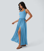 Robe longue fluide fendue avec poches latérales, dos nu et effet torsadé