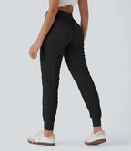 Pantalon jogging de voyage taille haute avec cordon de serrage, coupe fuselée et poches latérales zippées
