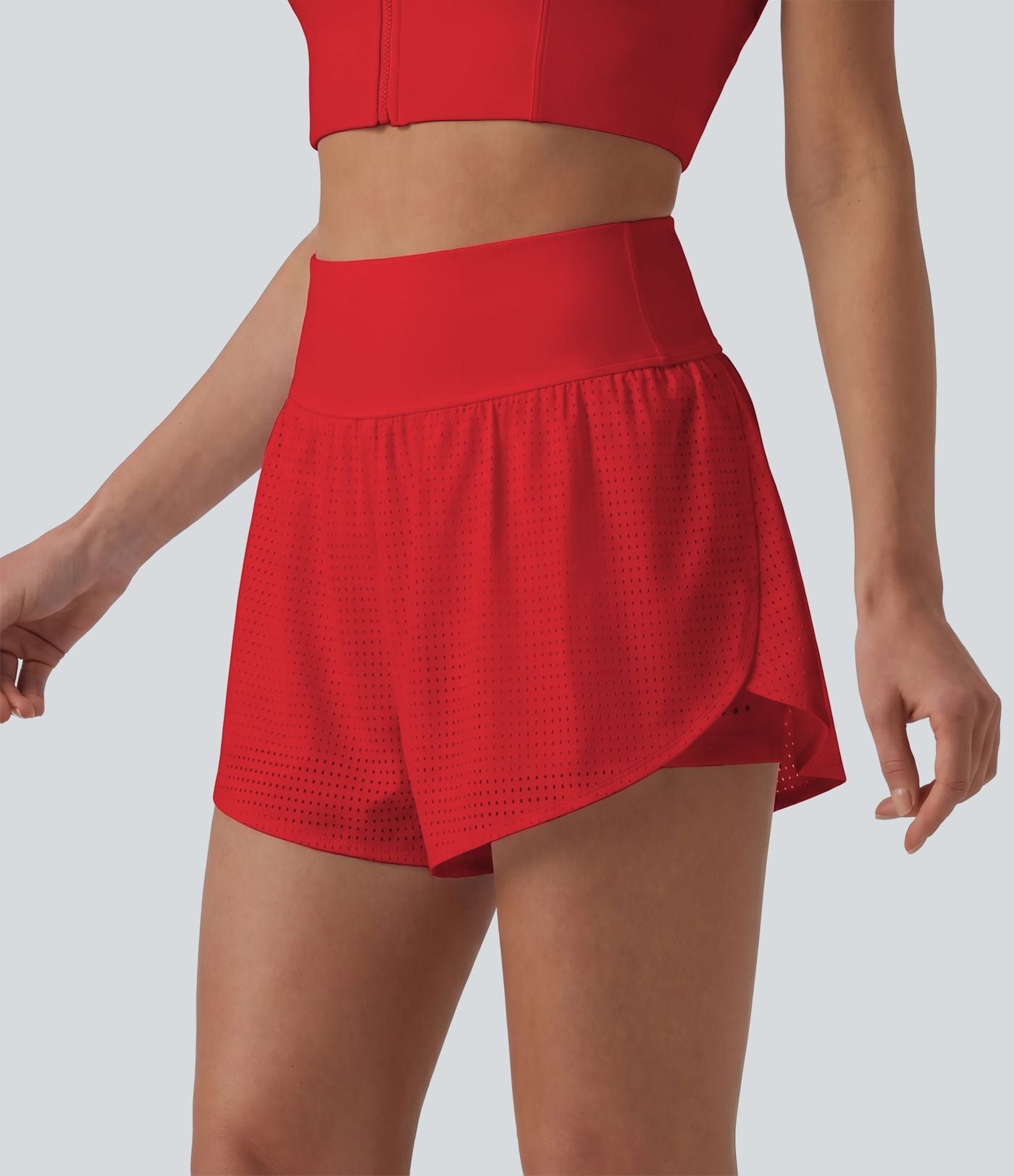 Short yoga 2-en-1 gainant taille haute à pois réfléchissants, ourlet arrondi croisé et œillets avec poches