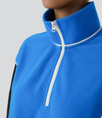 Sweat bicolore en polaire col montant avec demi-zip et manches longues