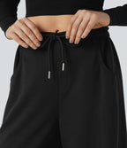 Pantalon jogging large taille mi-haute finition brute avec cordon de serrage et poches