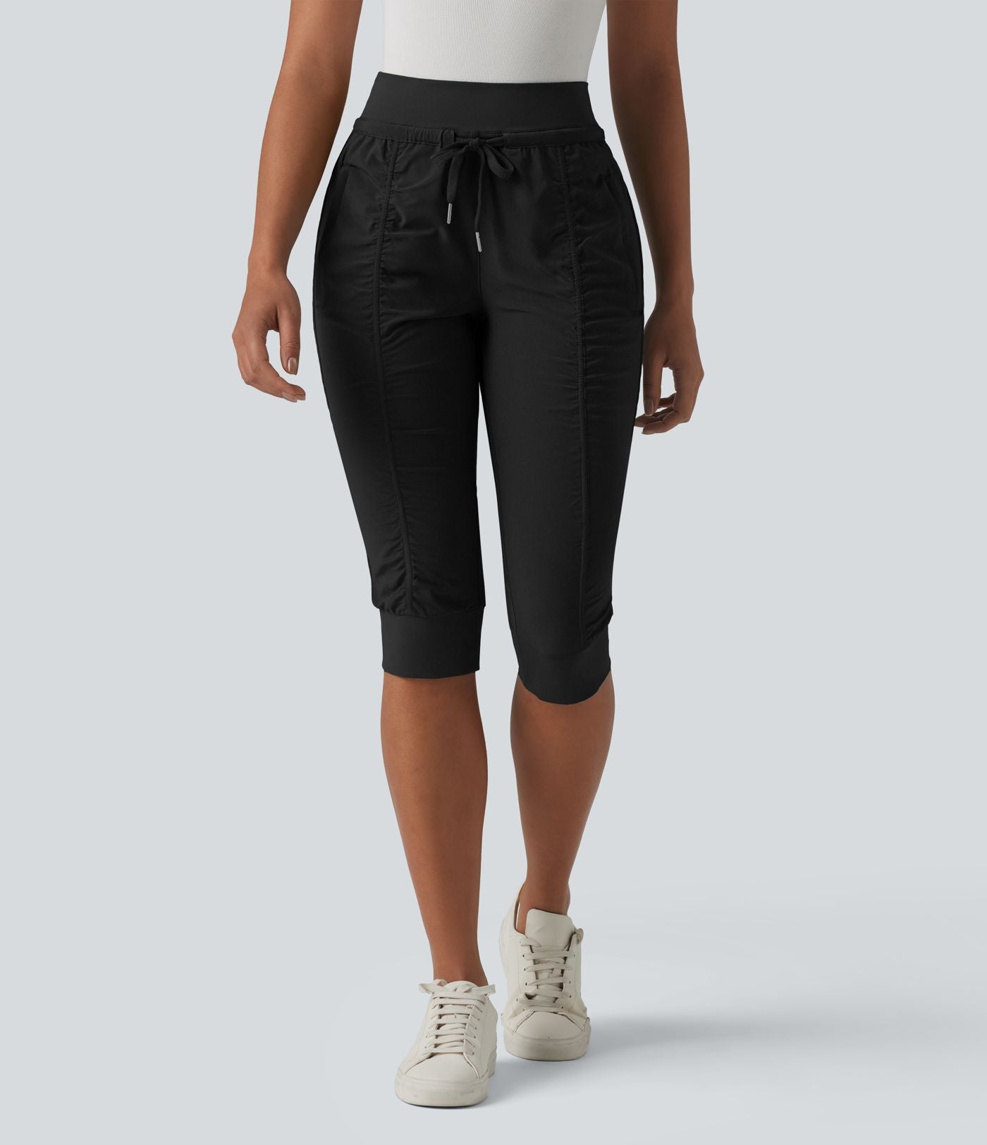 Jogging fuselé taille haute avec cordon de serrage et poches zippées