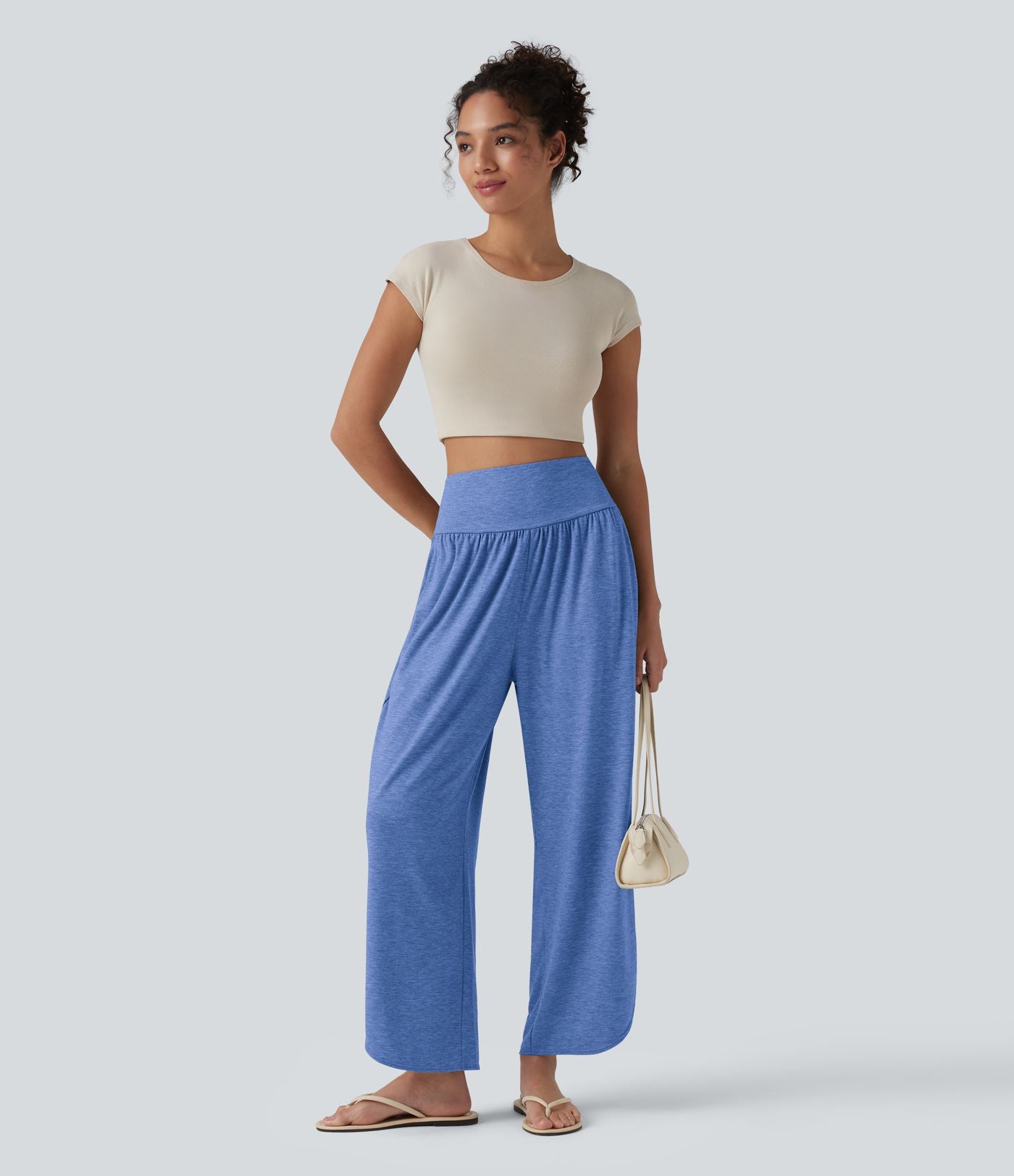 Pantalon décontracté taille haute gainant avec ourlet arrondi et poches